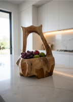 Natural Wonders USA Burl Wood Basket with integrated handle, 7" round x 15" tall, filled with fruit.