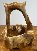 Natural Wonders USA burl wood basket with integrated handle, showcasing unique grain patterns and natural wood texture. 7" round x 15" tall.