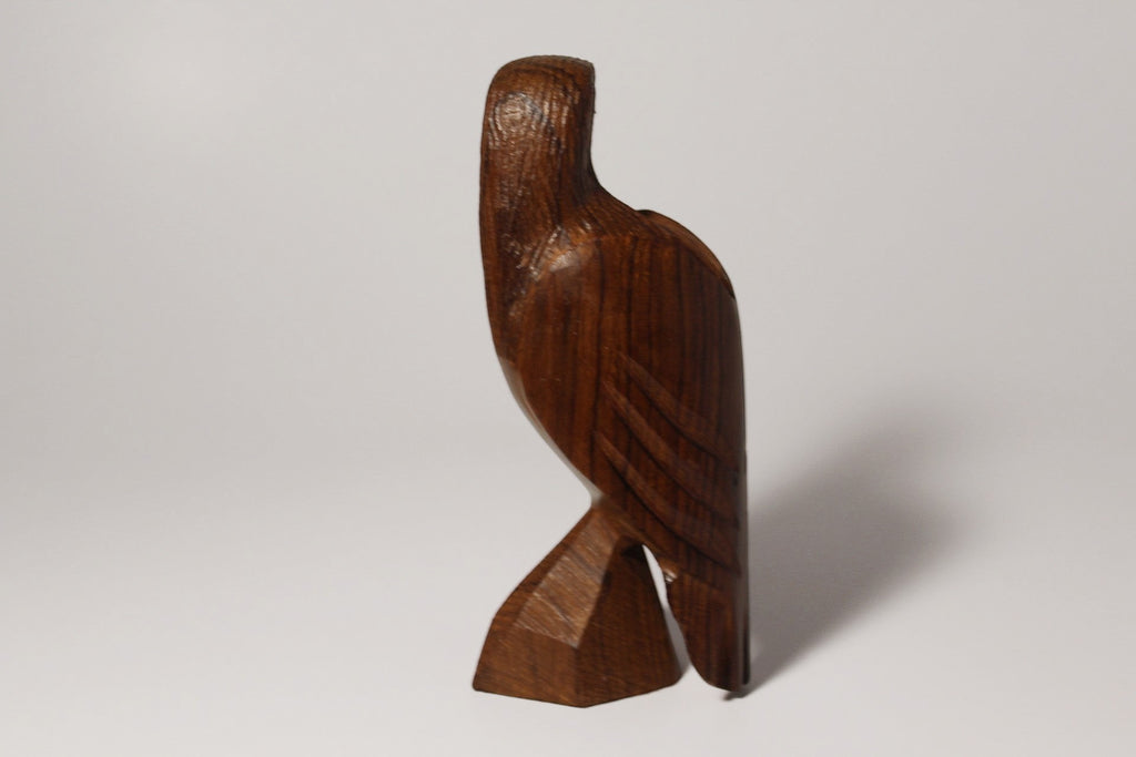 Natural Wonders USA hand-carved dark wood eagle figurine with detailed feathers and natural grain patterns.
