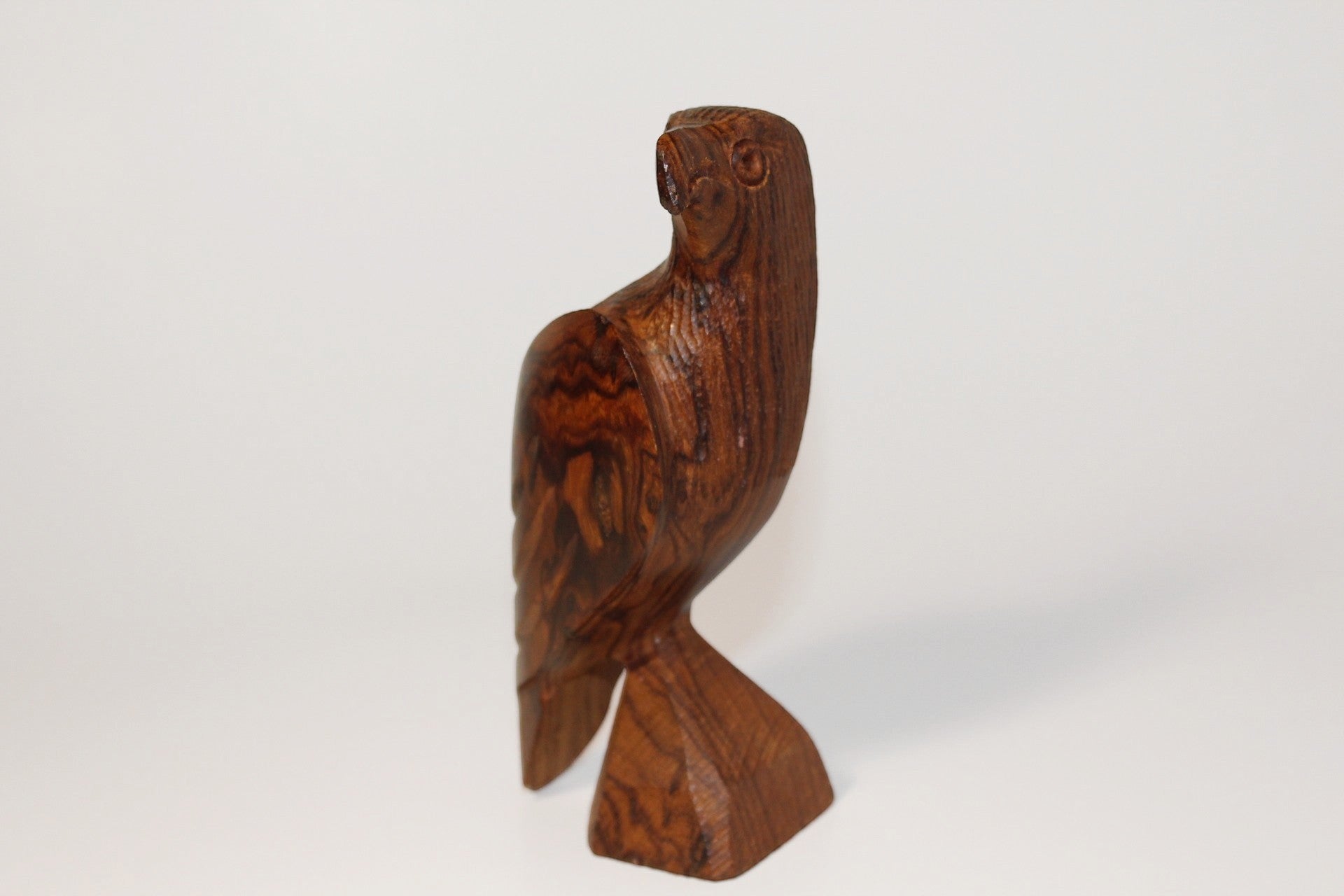 Natural Wonders USA hand-carved dark wood eagle figurine with detailed feathers and natural grain patterns.