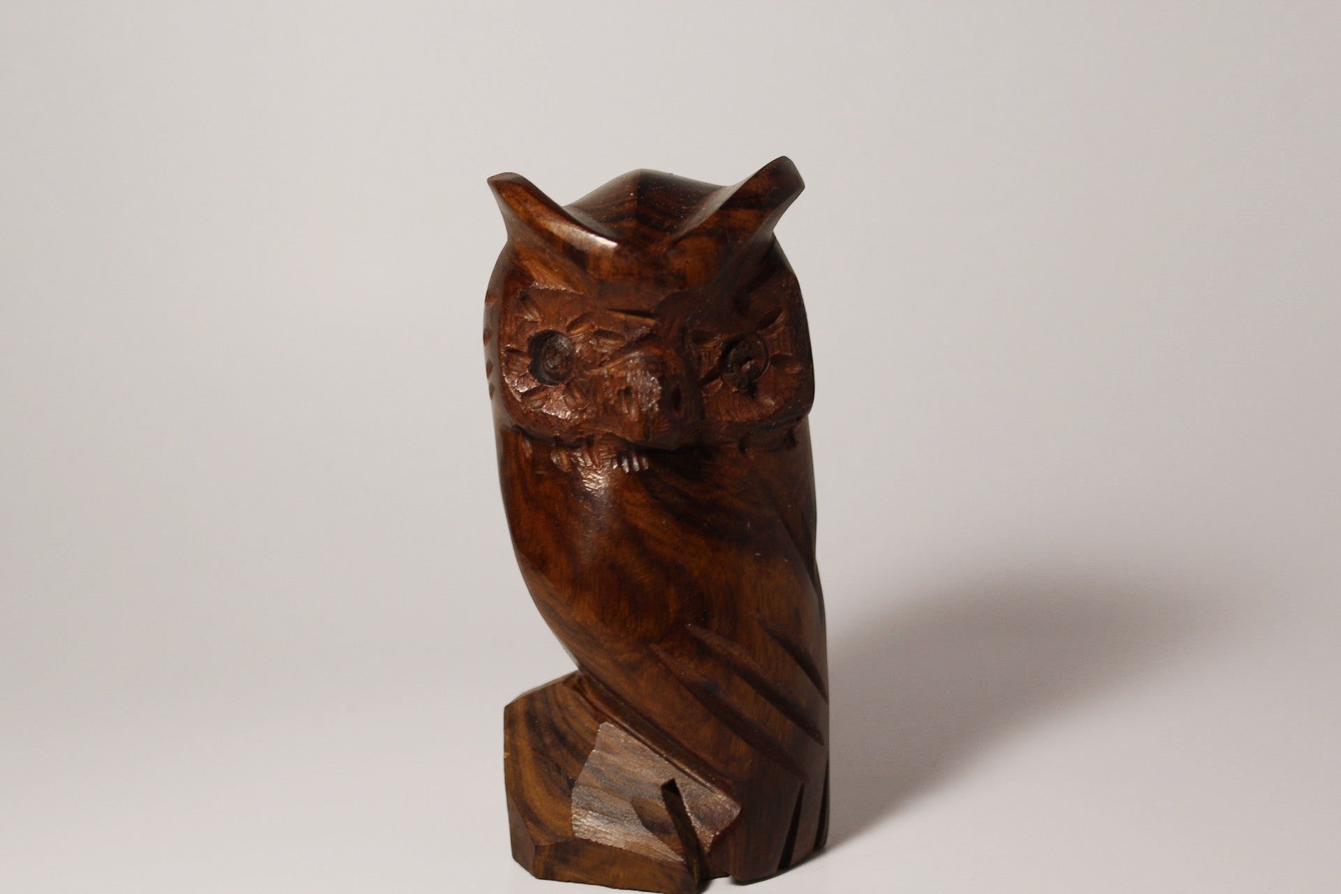 Natural Wonders USA hand-carved dark wood owl figurine with intricate feather details and alert eyes.