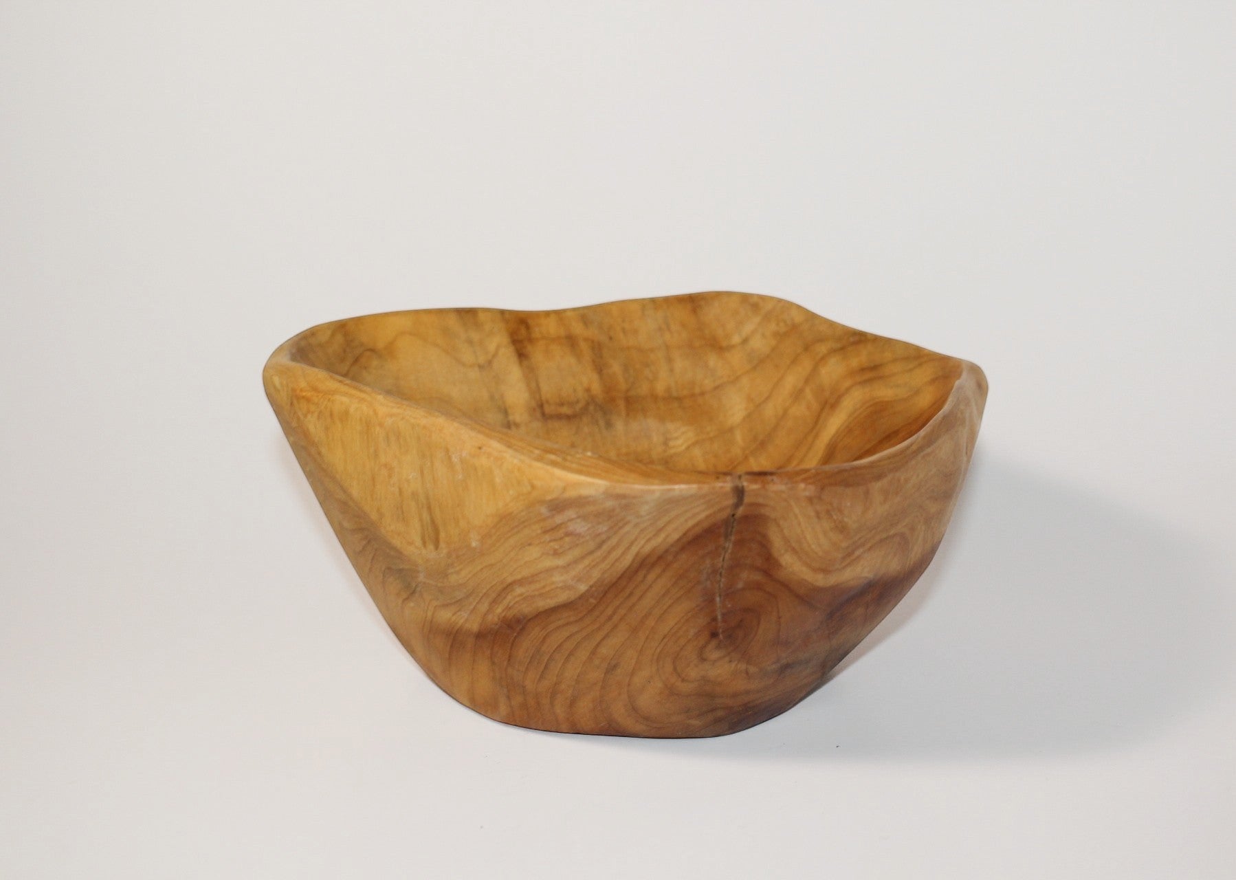 Natural Wonders USA cedar wood nibble dish with natural grain and rustic oval shape, 1.5" H x 6" L x 4.5" W.