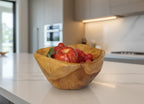 Natural Wonders USA cedar wood nibble dish with visible grain, holding an apple and grapes.