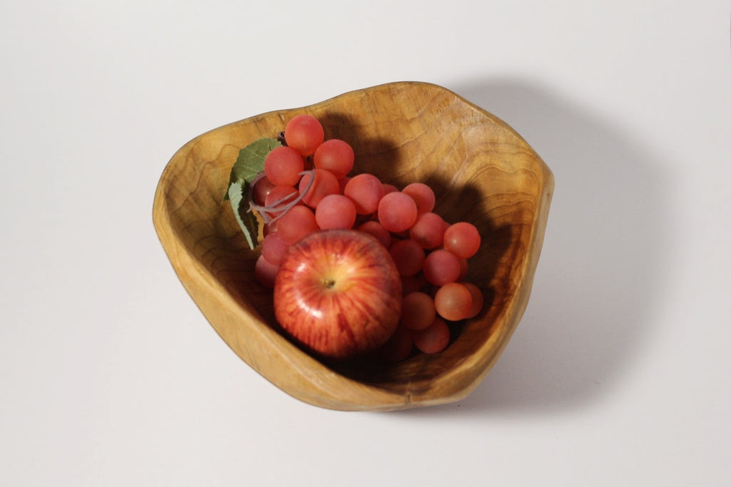 Natural Wonders USA cedar wood nibble dish with red apple and grapes. Rustic oval serving bowl.