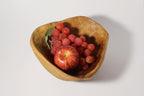 Natural Wonders USA cedar wood nibble dish with red apple and grapes. Rustic oval serving bowl.
