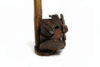 Natural Wonders USA rustic cedar wood wine bottle holder with dark stain and natural grain detail.