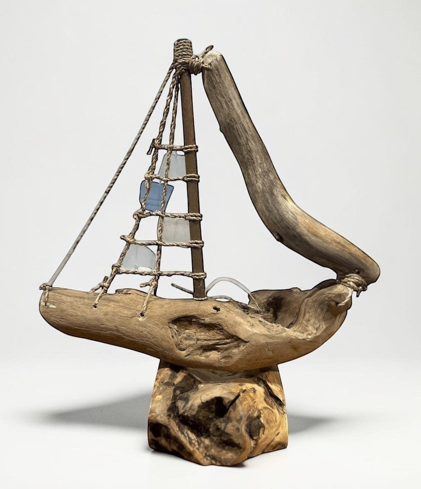 Natural Wonders USA sea glass and driftwood boat sculpture with blue and clear sails, 18