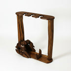 Natural Wonders USA rustic driftwood display stand with 3 slots for canes or staffs. Features sculptural base and natural wood tones.