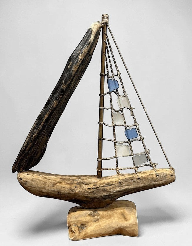 Natural Wonders USA sea glass and driftwood boat sculpture with blue and white sails, 18