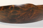 Natural Wonders USA hand carved dark wood serving bowl with organic shape and captivating grain patterns.