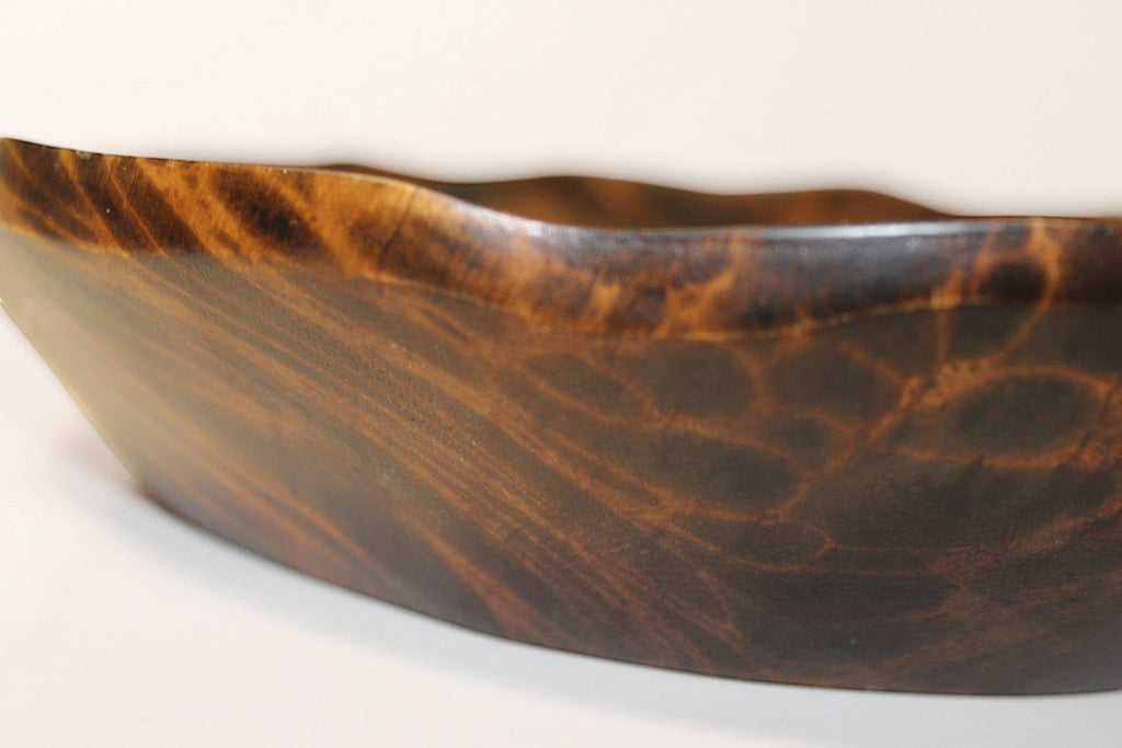 Natural Wonders USA hand carved dark wood serving bowl with organic shape and rustic rim.