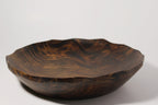 Natural Wonders USA hand carved dark wood serving bowl with organic shape and wavy rim. Unique grain patterns.