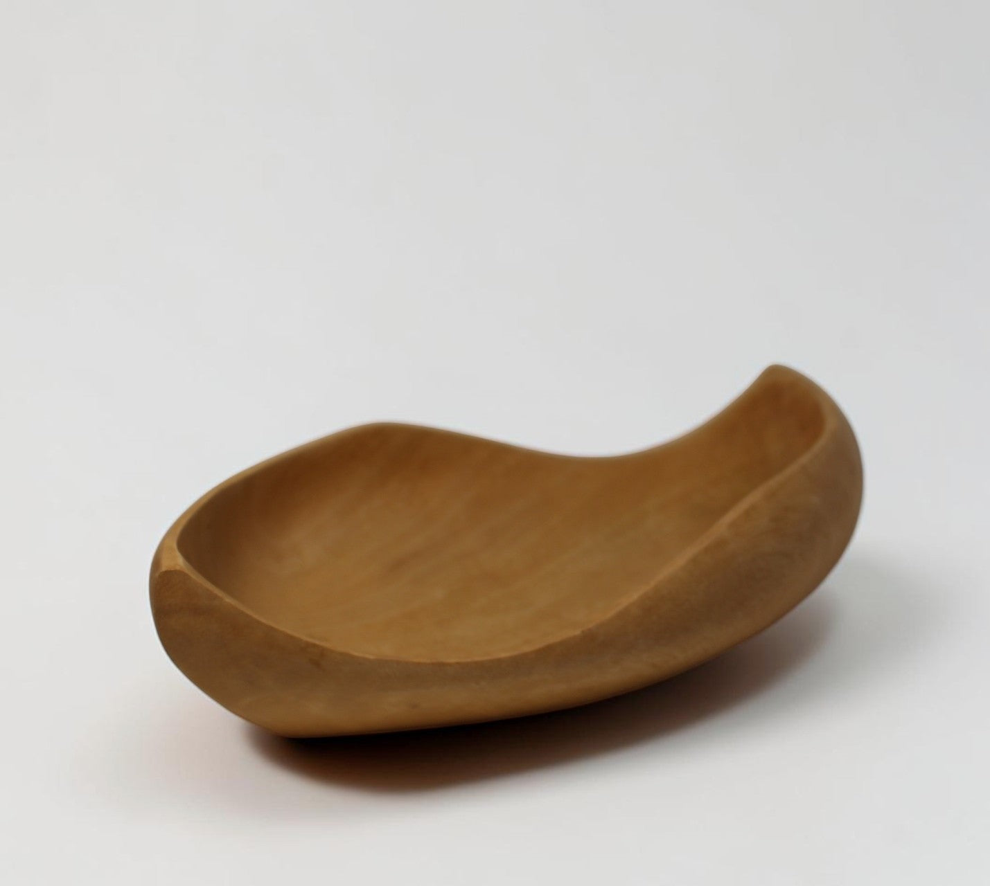 Natural Wonders USA hand carved light wood serving bowl with organic shape and matte finish.