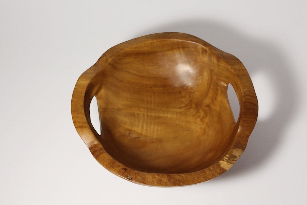 Natural Wonders USA hand carved wooden serving bowl with integrated handles, warm tone, natural grain.