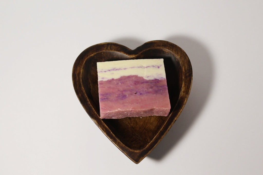 Natural Wonders USA dark wood heart-shaped serving bowl with layered pink and white soap.
