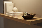 Natural Wonders USA dark wood heart-shaped serving bowl with a watch inside, showcasing natural grain.