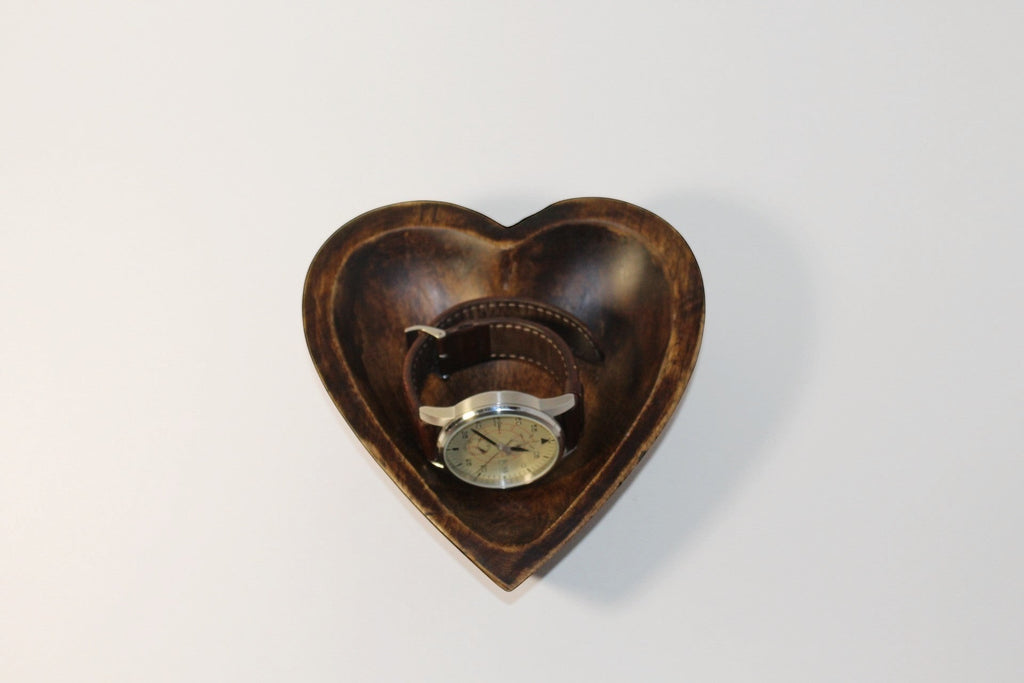 Natural Wonders USA dark wood heart-shaped serving bowl with a watch inside, showcasing natural grain.