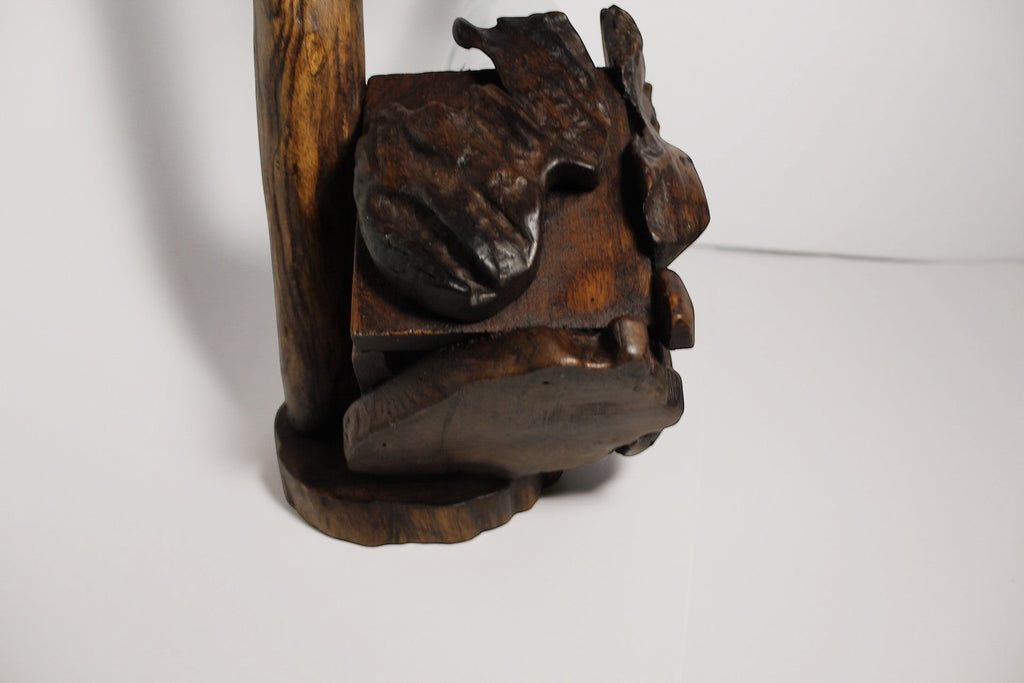 Natural Wonders USA rustic dark wood wine bottle holder and glass stand, handcrafted with unique sculptural form.