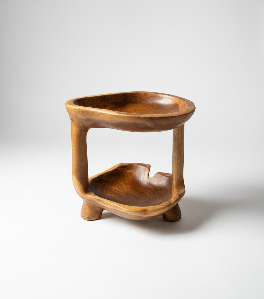 Natural Wonders USA teakwood tier stand, 12" tall, for fruits or centerpiece display. Features two carved bowls.