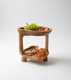 Natural Wonders USA teakwood tier stand, 12" tall, 10" wide, with two carved bowls for fruit or food display.
