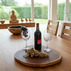 Natural Wonders USA 16" round teakwood lazy Susan serving tray with grapes and wine bottle.