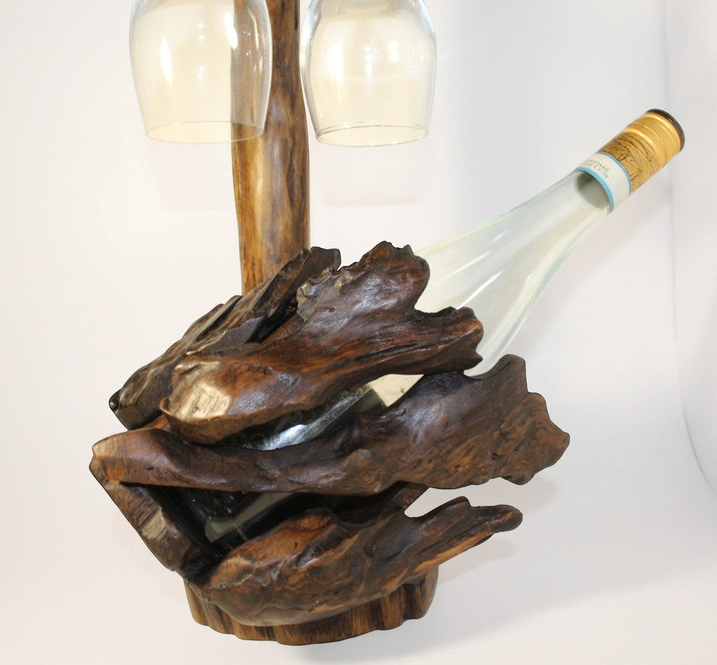 Natural Wonders USA rustic dark wood wine bottle holder and glass stand with sculptural form.