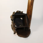 Natural Wonders USA rustic wood wine bottle holder and glass stand, dark wood, sculptural form, unique handcrafted piece.