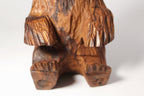 Natural Wonders USA rustic hand carved wooden bear figurine, seated position, detailed wood grain, warm earthy tones.