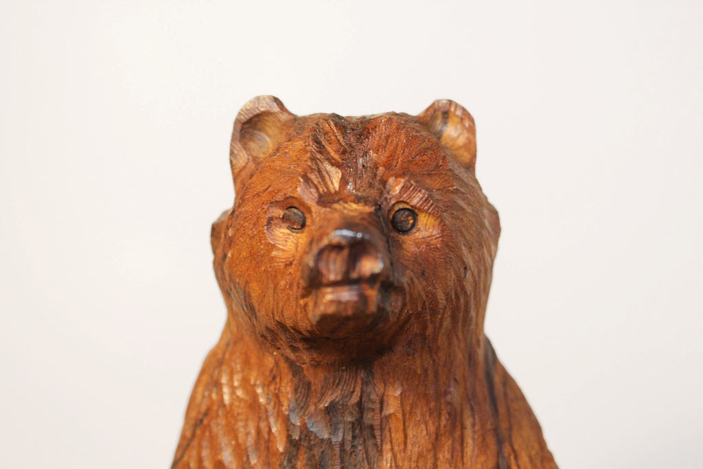 Natural Wonders USA rustic hand carved wooden bear figurine, warm brown with visible wood grain.