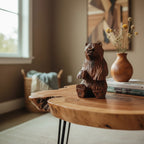Natural Wonders USA rustic hand carved wooden bear figurine, seated, detailed wood grain, warm brown.