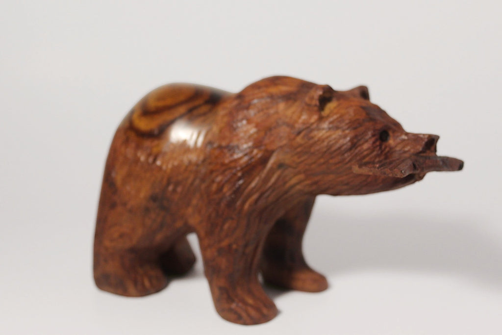 Natural Wonders USA hand-carved wooden bear figurine with fish in mouth, dark wood with natural grain, rustic decor accent.