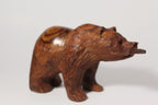 Natural Wonders USA hand-carved wooden bear figurine with fish in mouth, dark wood with natural grain, rustic decor accent.