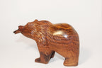 Natural Wonders USA hand-carved wooden bear figurine with fish in mouth, dark wood, rustic style.