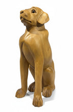 Natural Wonders USA wooden dog sculpture with smooth curves and detailed carving, 22" tall, natural wood finish.