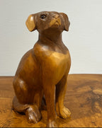 Natural Wonders USA wooden dog sculpture with smooth curves and detailed carving, 22" tall.