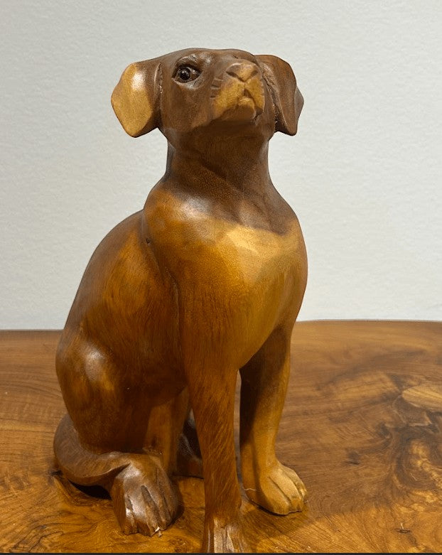 Natural Wonders USA wooden dog sculpture with smooth curves and detailed carving, 22" tall.