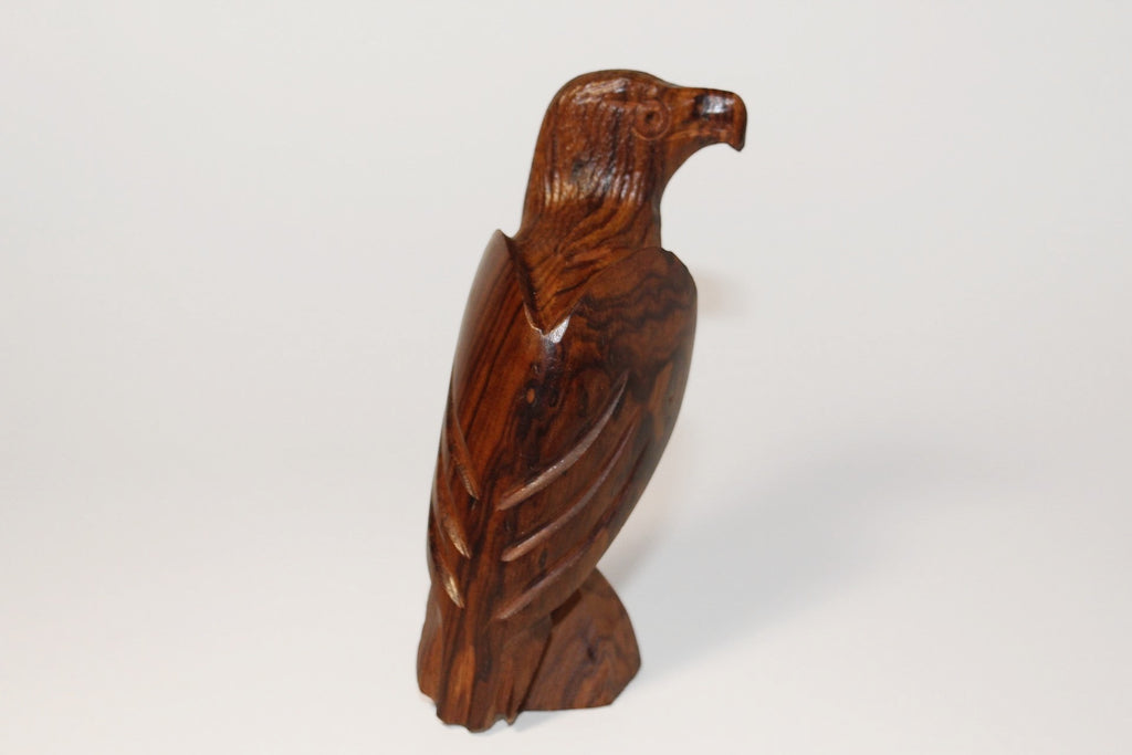 Natural Wonders USA hand-carved wooden eagle figurine. Dark wood with natural grain, detailed feathers, and polished finish.