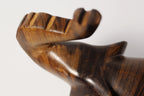 Natural Wonders USA dark wood elephant figurine with raised trunk, carved details, and natural grain.