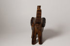 Natural Wonders USA dark wood elephant figurine with raised trunk, carved details, and natural grain.