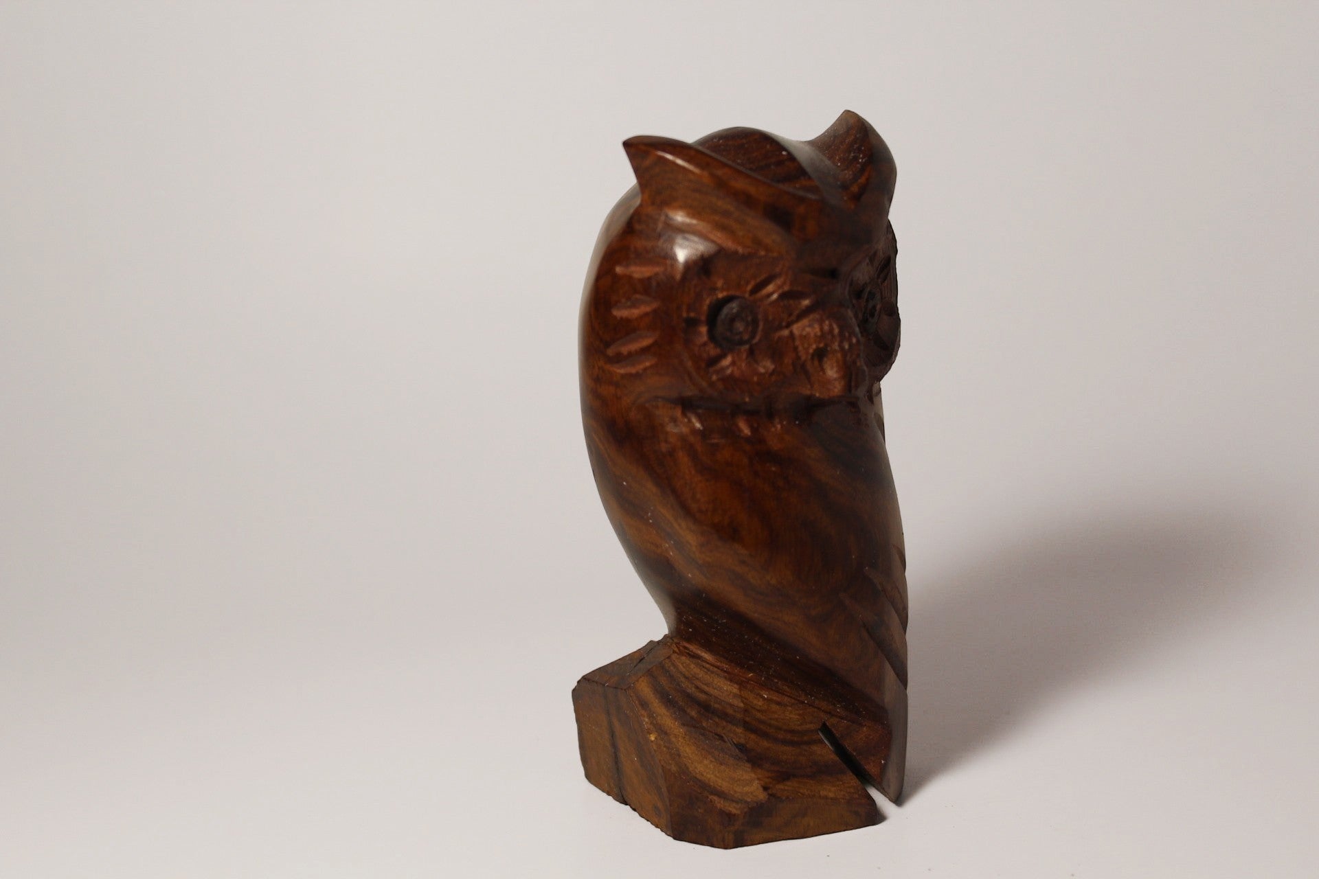 Natural Wonders USA hand-carved dark wood owl figurine with intricate feather details and natural grain.