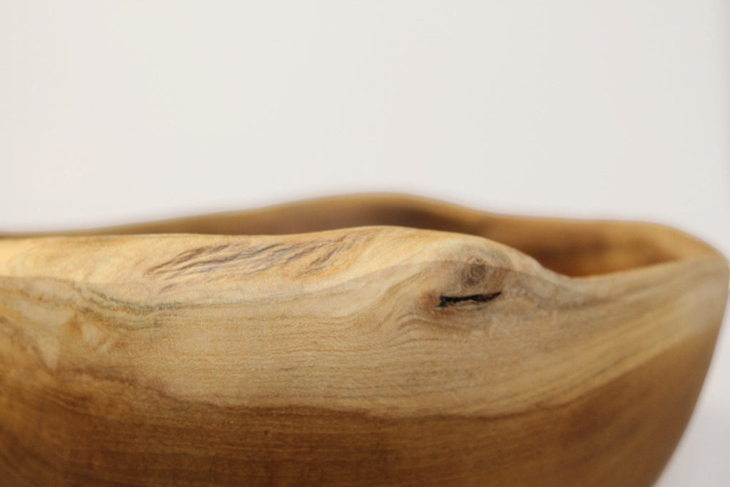 Natural Wonders USA rustic wooden serving bowl with unique grain patterns and earthy tones.